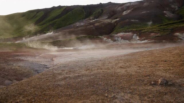 Mud pot, hot spring, fumarole in the landscape - north of Iceland