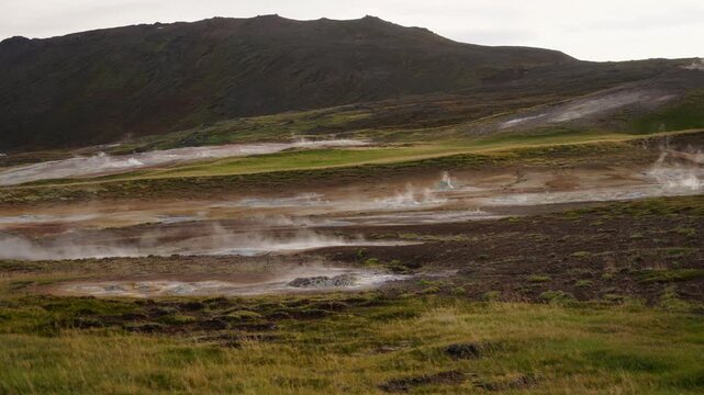 Mud pot, hot spring, fumarole in the landscape - north of Iceland
