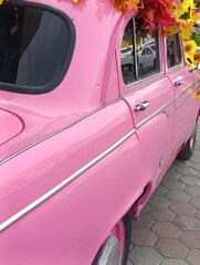 vintage car with pink flowers