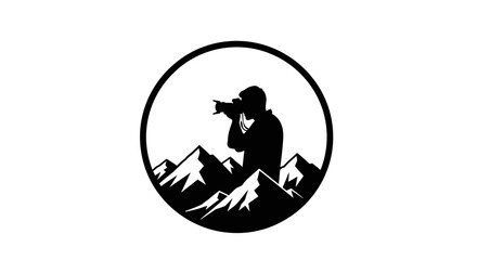 Silhouette of a photographer taking a picture in a mountainous landscape, enclosed in a circle.
