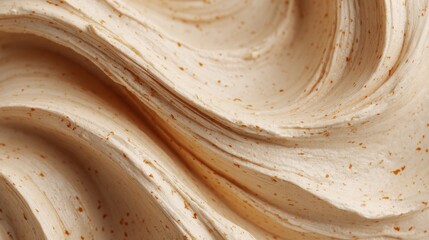 Close-Up Of Creamy Textured Substance With Speckled Pattern. Smooth And Rich Texture Ideal For Skincare Or Culinary Applications