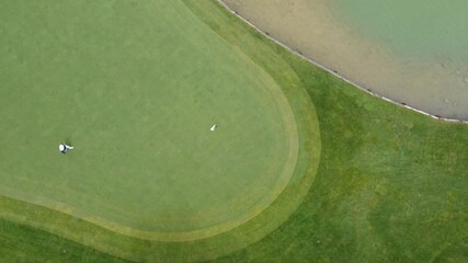 Golfer techniques on the fairway during afternoon play at local course
