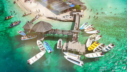 Drone view of Pulau Kelor surrounded by crystal clear waters in Komodo archipelago, Indonesia
