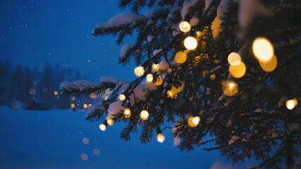 Snowy winter wonderland scene with glowing Christmas lights twinkling on an evergreen tree branch as gentle snow falls on a cold night - Powered by Adobe