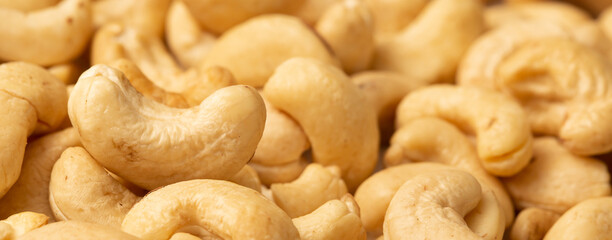 Cashew nuts as a background, top view. Cashew isolated on white background. Healthy foods.