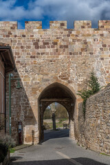 Naklejka premium Royal Walk Gate Historic Stone Arch Aguilar de Campoo