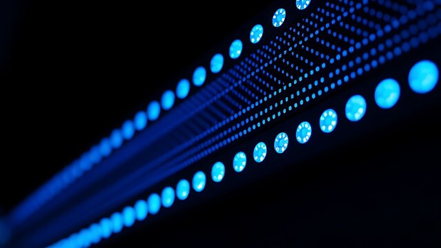 Close-up of glowing blue server rack lights creating an abstract technological pattern on a dark background. - Powered by Adobe
