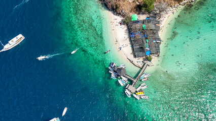 Beautiful panoramic drone view over Pulau Kelor Komodo showing crystal clear tropical ocean