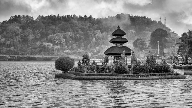 Scenic view of Pura Ulun Danu Beratan Bedugul temple surrounded by lake and misty highlands in Bali