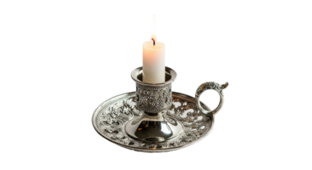 Ornate silver candle holder with burning candle on black background