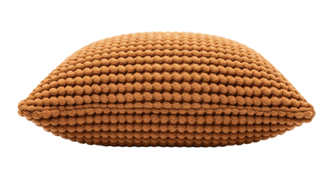 Textured brown pillow with crochet design on black background