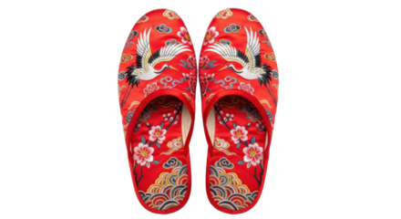 Red slippers with crane and floral design on black background