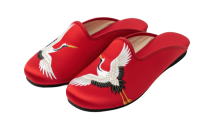 Red slippers with white crane embroidery on black background