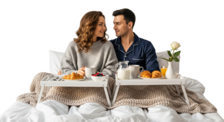 Caucasian couple enjoying breakfast in bed with croissants and coffee on a cozy morning