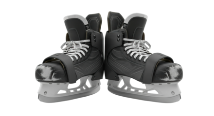Pair of black ice hockey skates with white laces on ice rink