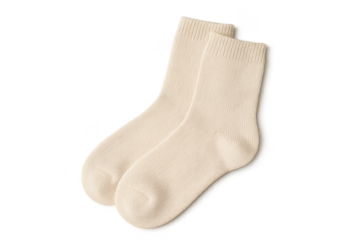 Pair of beige socks isolated on a transparent background, comfortable textile