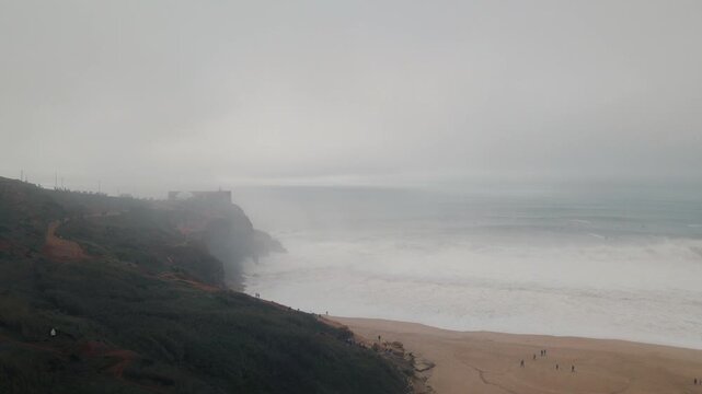 Experience the thrill of nazare big waves in portugal's atlantic ocean