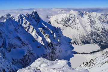 View from the summit of Rysy on the Morskie Oko lake and Czarny Staw pod Rysami lake in winter, High Tatras, Poland © Aneta
