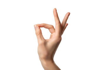 Close Up Of A Woman's Hand Forming An Ok Gesture With Her Fingers Against A Black Background Demonstrating Approval And Perfection In A Studio Shot