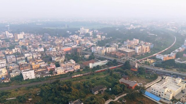 4K Aerial View of Green Park and Urban Forest Surrounded by City Buildings and Smog in Delhi. High AQI situation in Delhi. 