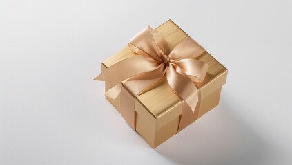 Obraz premium Elegant gold gift box with ribbon on a light background, top view