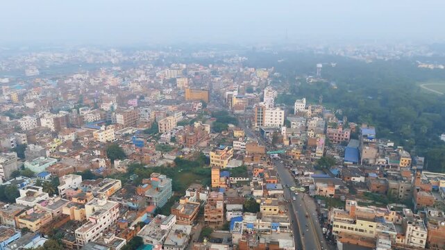 4K Aerial View of Green Park and Urban Forest Surrounded by City Buildings and Smog in Delhi. High AQI situation in Delhi. 