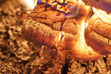 Close-up of a hearth. Wood burning in a rustic stove. Photo taken with a long exposure.