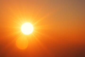 The sun shines brightly in the sky with a warm orange glow at sunset