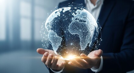 Businessman holding a digital globe with interconnected network, representing global business and technology connection