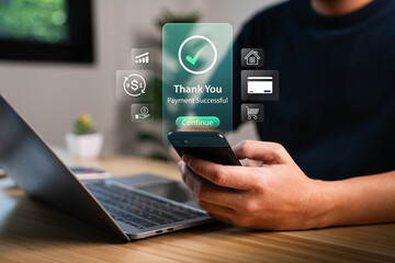 Man using smartphone for online payment with holographic thank you message showing payment successful and digital icons, representing fintech innovation, secure mobile transaction, cashless economy