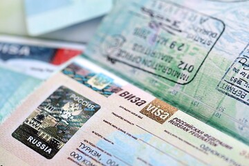 Fragment of Russian Federation visa in passport page close up. Concept of travel and tourism worldwide