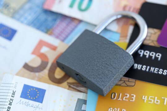 Euro money bills banknotes and credit cards with padlock. Concept of online banking safety and security - Powered by Adobe