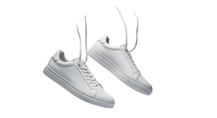 Pair of clean white leather low top sneakers with white laces hanging isolated on transparent background
