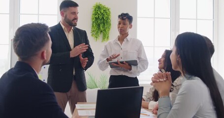 Diverse multiracial business team discussing a marketing strategy in a work meeting Group of caucasian and biracial corporate employees and leaders together working on a project in an office workplace - Powered by Adobe