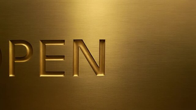 ブラッシュド加工が施されたゴールドメタルにOPEN文字が深く刻まれ、カメラがゆっくりとスライドしながら重厚な質感を映し出す映像。
ヘアラインの走る金属表面と彫り込みの陰影が、高級感と精緻なクラフト感を演出。
