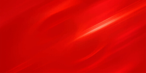Flowing red silk and satin textile fabric background displaying a soft, elegant texture and pattern