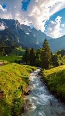 Obraz premium A vibrant scenic view of a mountain range with a cascading stream flowing through a lush green valley under a bright sky