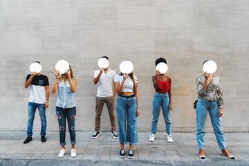 Obraz premium People holding blank sign template for text, anonymity, identity, concept, group, urban youth