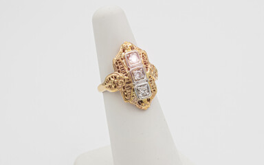 Vintage yellow gold diamond ring on a white background