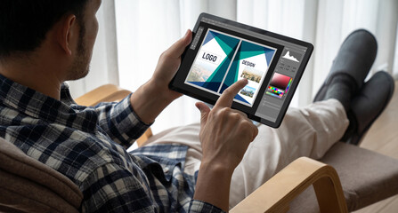 Graphic designer software for modern design of web page and commercial ads showing on the computer screen