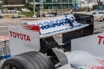 Naklejka premium Displayed Formula 1 car, Toyota TF-108 White base with red and blue accents, sponsorship logos Toyota, Panasonic, others Angled view emphasizing aerodynamic desig - Kyiv, Ukraine 10-10-2024