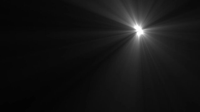 High-quality stock footage of sun rays light effects, for desi Optical Lens flare light background. White Lamp Rays Shining on Black Background,  sun rays or god bless rays' effect. white light ray .