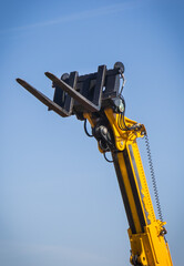 Forklift loader or stacker. Hydraulic and pneumatic mechanism in machine. Technology in transport