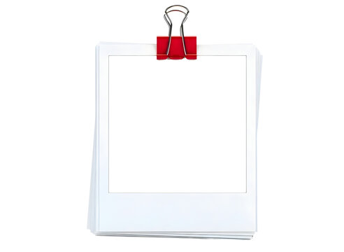 Stack of polaroid photos held by a red binder clip isolated on transparent background