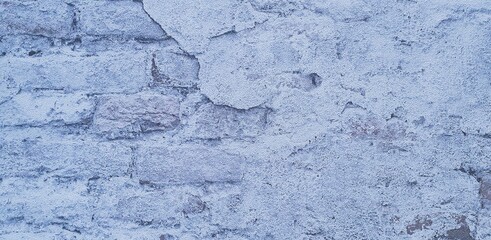 Verwitterte alte hellblaue Mauer als Hintergrund 