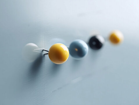 Closeup of colorful push pins on a grey surface. Shallow depth of field. Visual metaphor for planning, office, or decisionmaking. Perfect for business or creative project. - Powered by Adobe