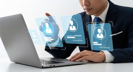 Businessman interacting with a holographic interface displaying user profiles and data on a laptop screen, representing digital recruitment and hr technology