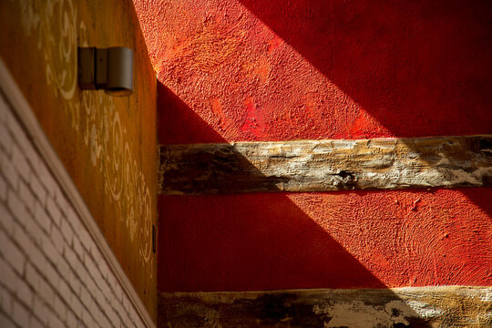 Geometric light and shadow patterns displayed on the wall