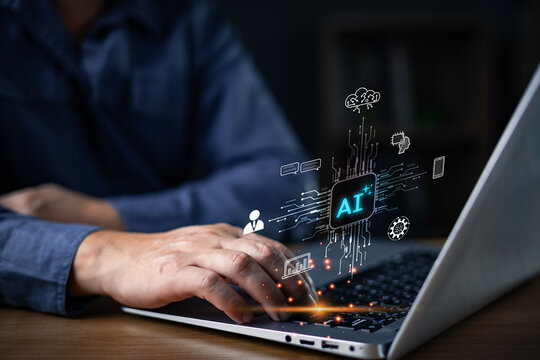 A person works on a laptop as glowing AI graphics emerge, symbolizing advanced machine learning,digital innovation,and intelligent technology enhancing modern computing and workflow efficiency. - Powered by Adobe