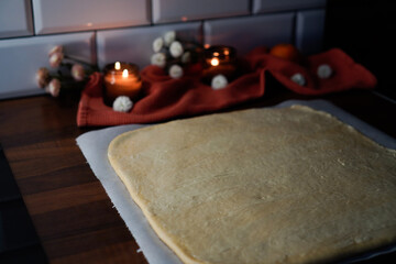 Rolled out baking dough on a kitchen table
